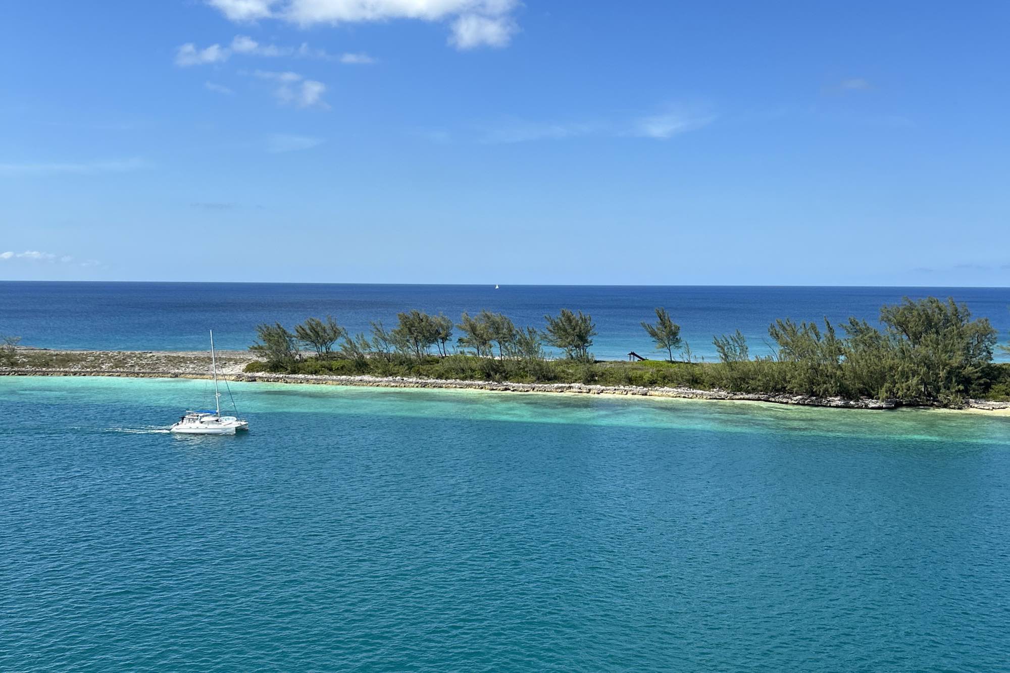 Turquoise Caribbean water and a small island seen from a cruise ship